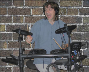 However you make it, making music is fun. Me on the drums at a gig.